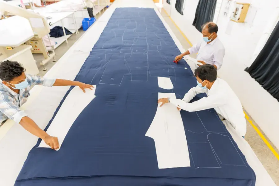 Fabric and patterns prepared for cutting at Cossmo Tex
