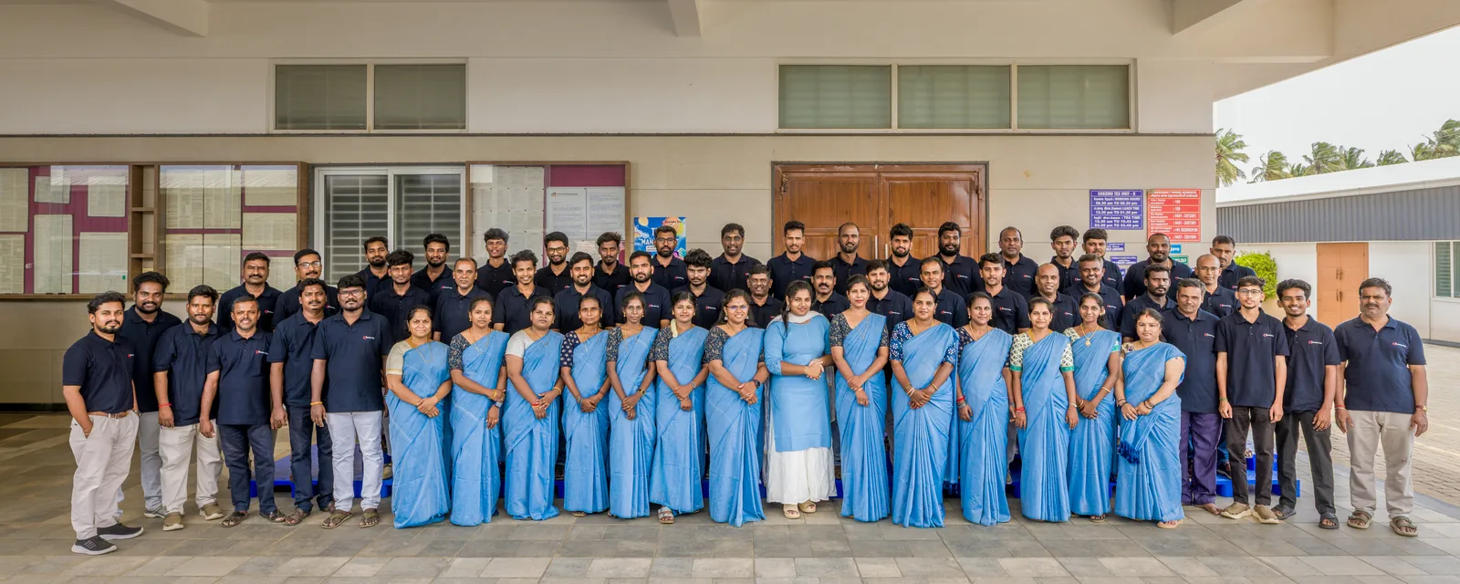 The Cossmo Tex team assembled outside the Tirupur factory